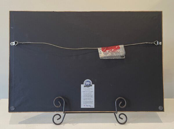 A black frame with a tag on it.