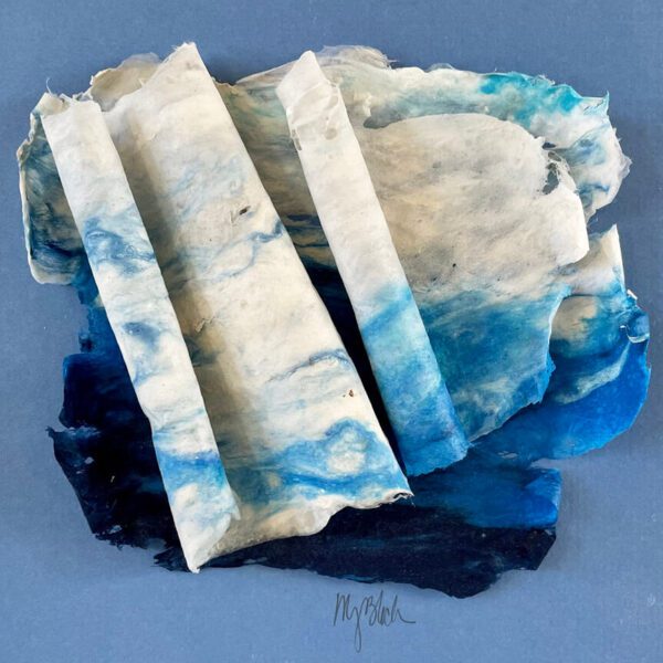 A blue and white piece of paper on a blue background.
