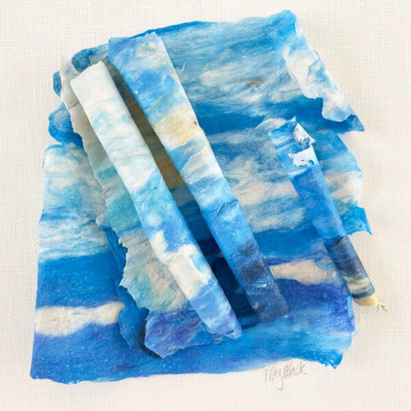 A piece of paper with blue and white clouds on it.
